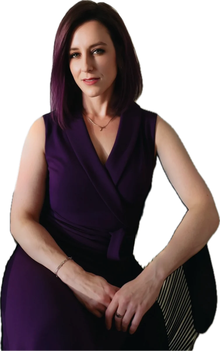 Jade Desires, seated, in a purple wrap dress